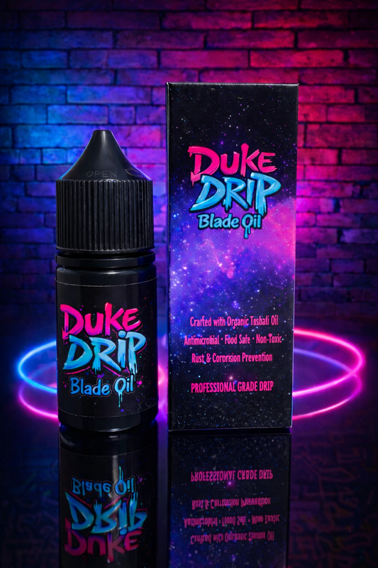 Duke Drip Blade Oil bottle and packaging against a brick wall background